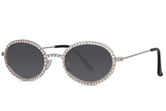 Ovale hurtigbriller med diamantpynt i kanterne, tynde stænger og grå glas set fra siden