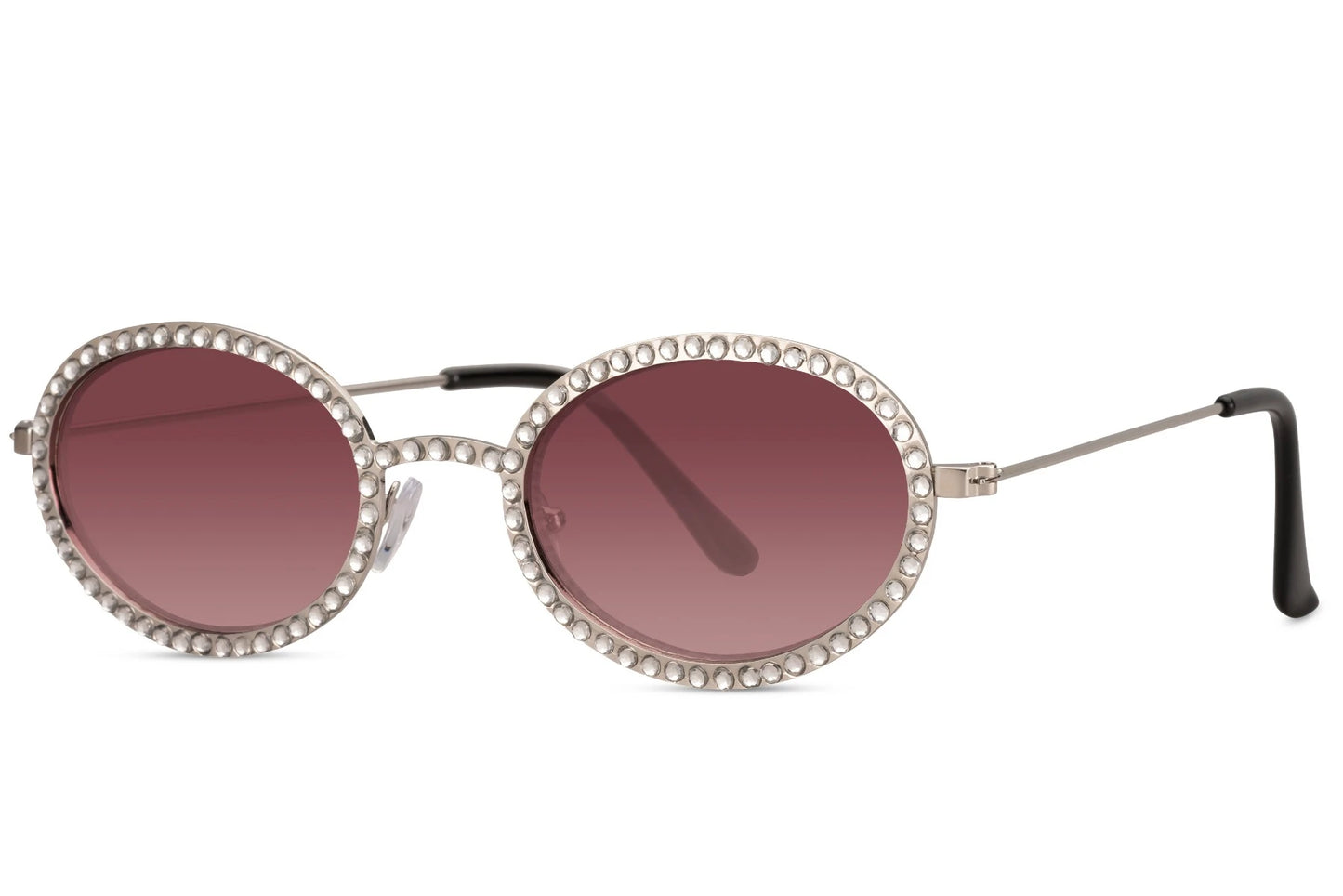 Ovale hurtigbriller med diamantpynt i kanterne, tynde stænger og røde glas set fra siden