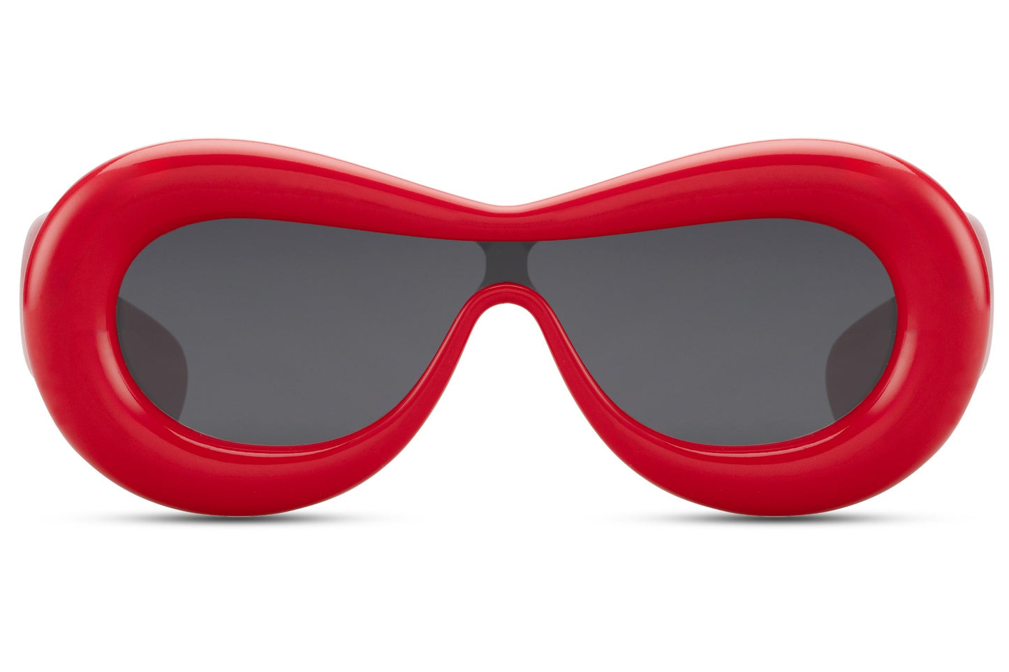 Tykke ovale hurtigbriller med ét glas og rødt stel set fra fronten