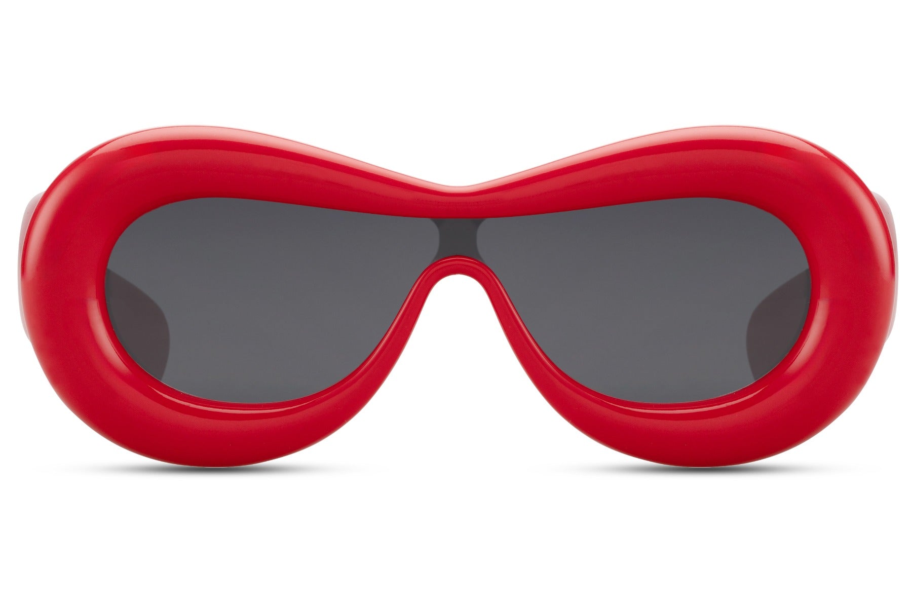 Tykke ovale hurtigbriller med ét glas og rødt stel set fra fronten