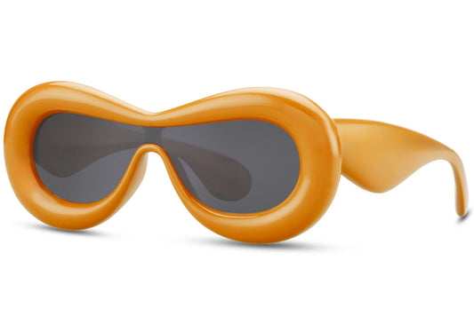 Tykke ovale hurtigbriller med ét glas og orange stel set fra siden